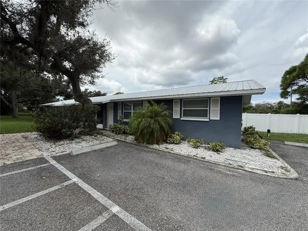 a front view of a house with a yard and a garage