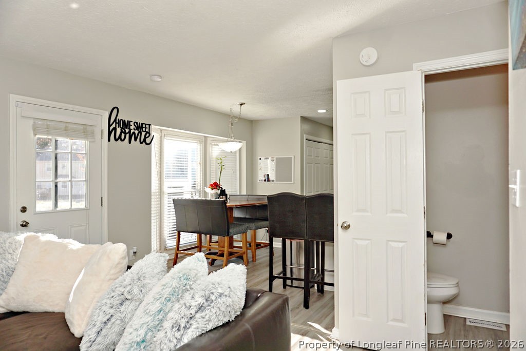 8363 King Road Fayetteville, NC 28306 - Photo 13 of 44 a living room with furniture and a large window