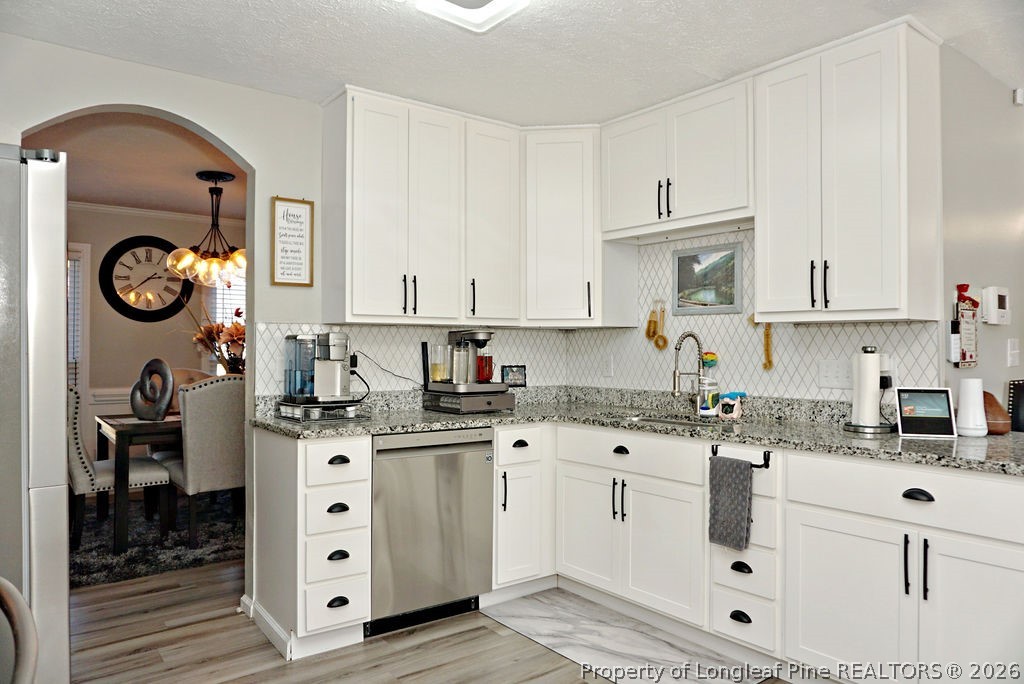 8363 King Road Fayetteville, NC 28306 - Photo 20 of 44 a kitchen with stainless steel appliances granite countertop a sink a stove and cabinets