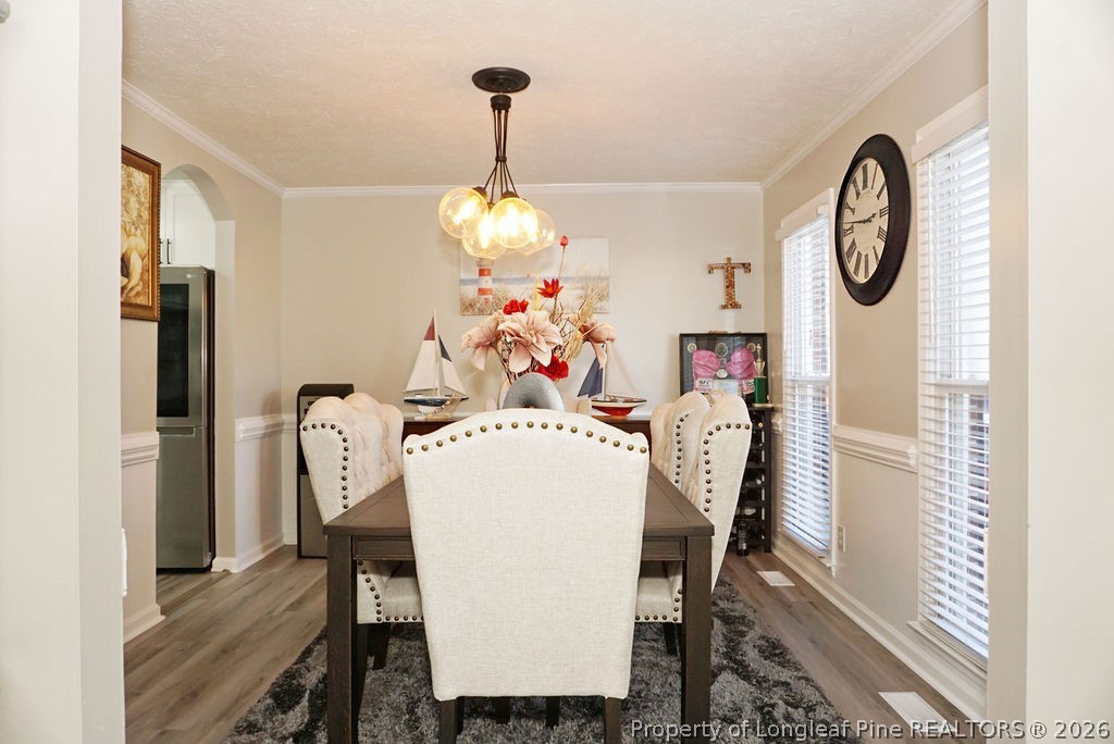 8363 King Road Fayetteville, NC 28306 - Photo 5 of 44 a dining room with furniture a chandelier and a rug