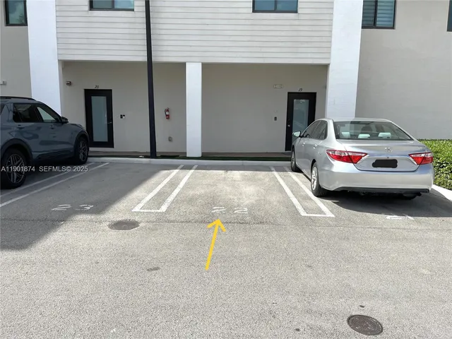 a view of car parked in front of a house