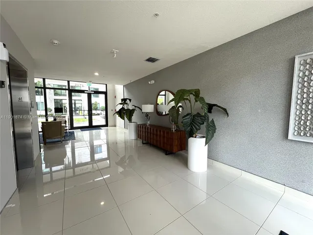 a lobby with a chandelier