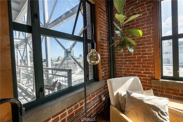 a view of a hallway with wooden shelves and glass door