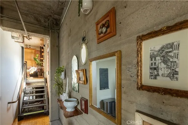 a kitchen with stainless steel appliances a refrigerator a sink a stove and cabinets