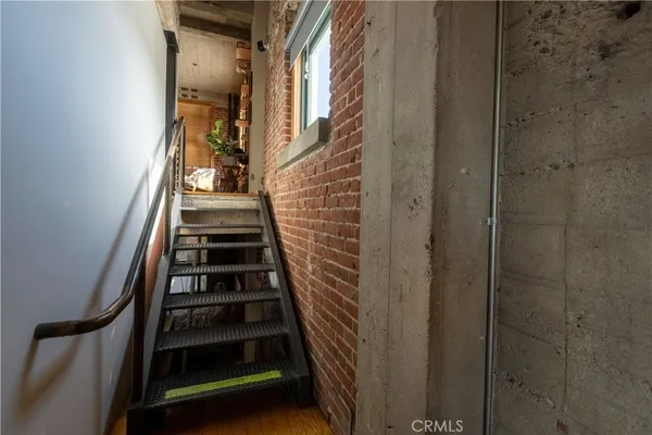 a bedroom with a bed window and outside view