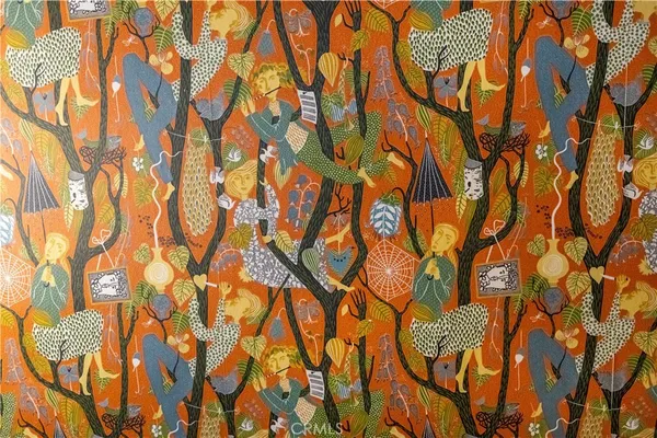 a roof deck with table and white wooden fence