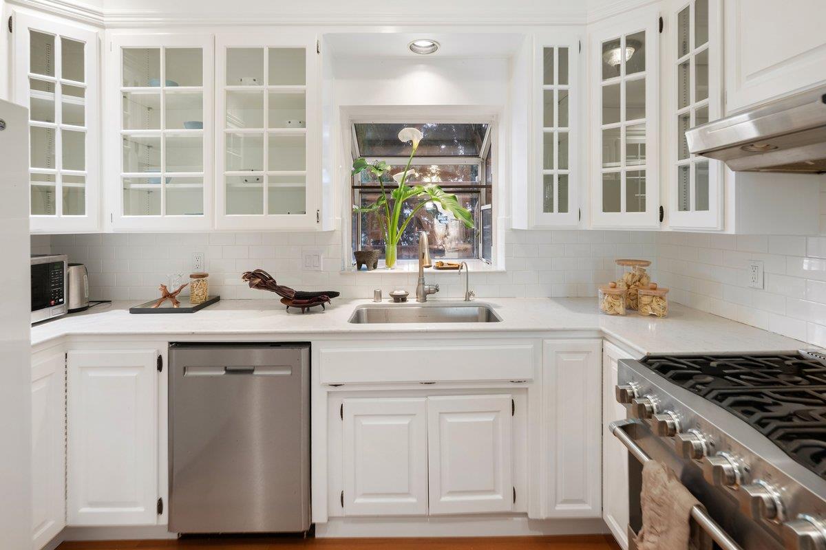 769 Jackson Street Santa Clara, CA 95050 - Photo 12 of 40 a kitchen with stainless steel appliances granite countertop a sink stove and cabinets