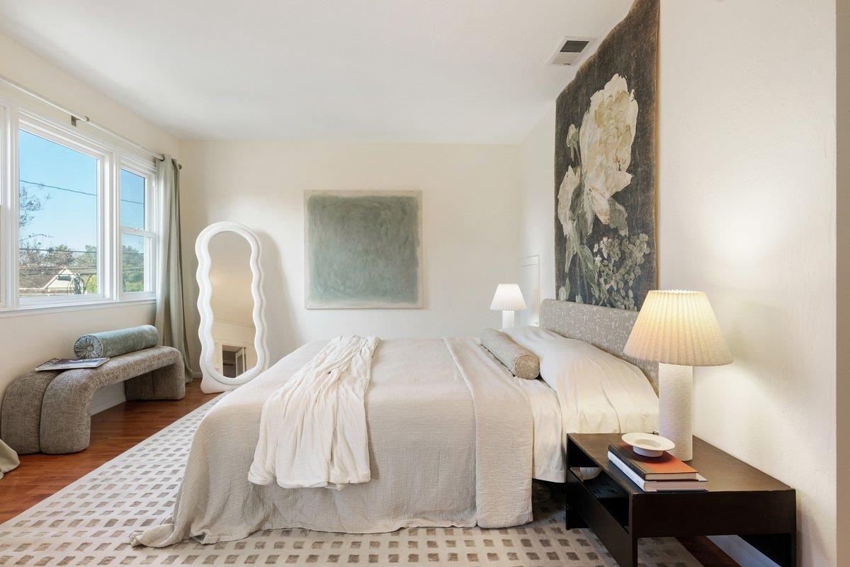769 Jackson Street Santa Clara, CA 95050 - Photo 19 of 40 a bedroom with a bed and a table