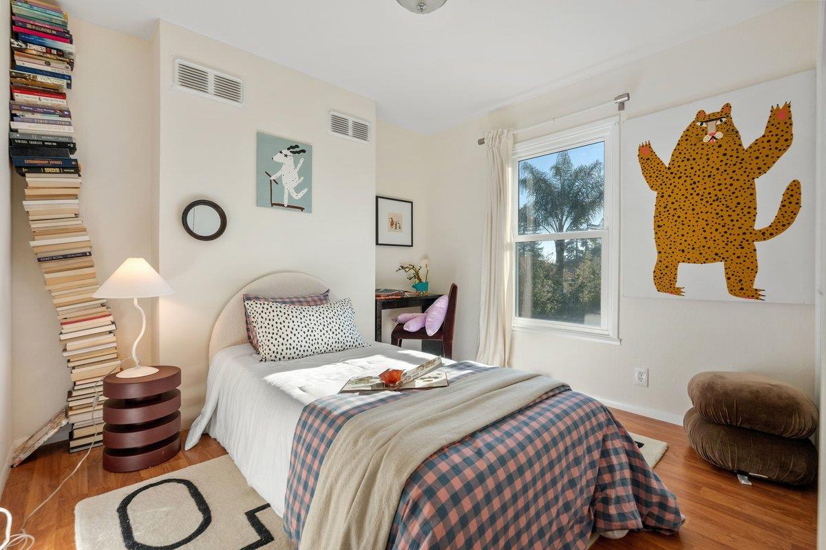 769 Jackson Street Santa Clara, CA 95050 - Photo 25 of 40 a bedroom with a bed and wooden floor