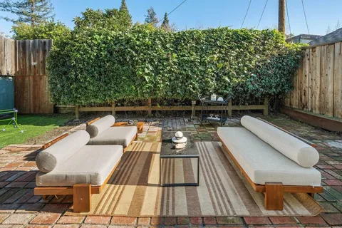 swimming pool view with a seating space