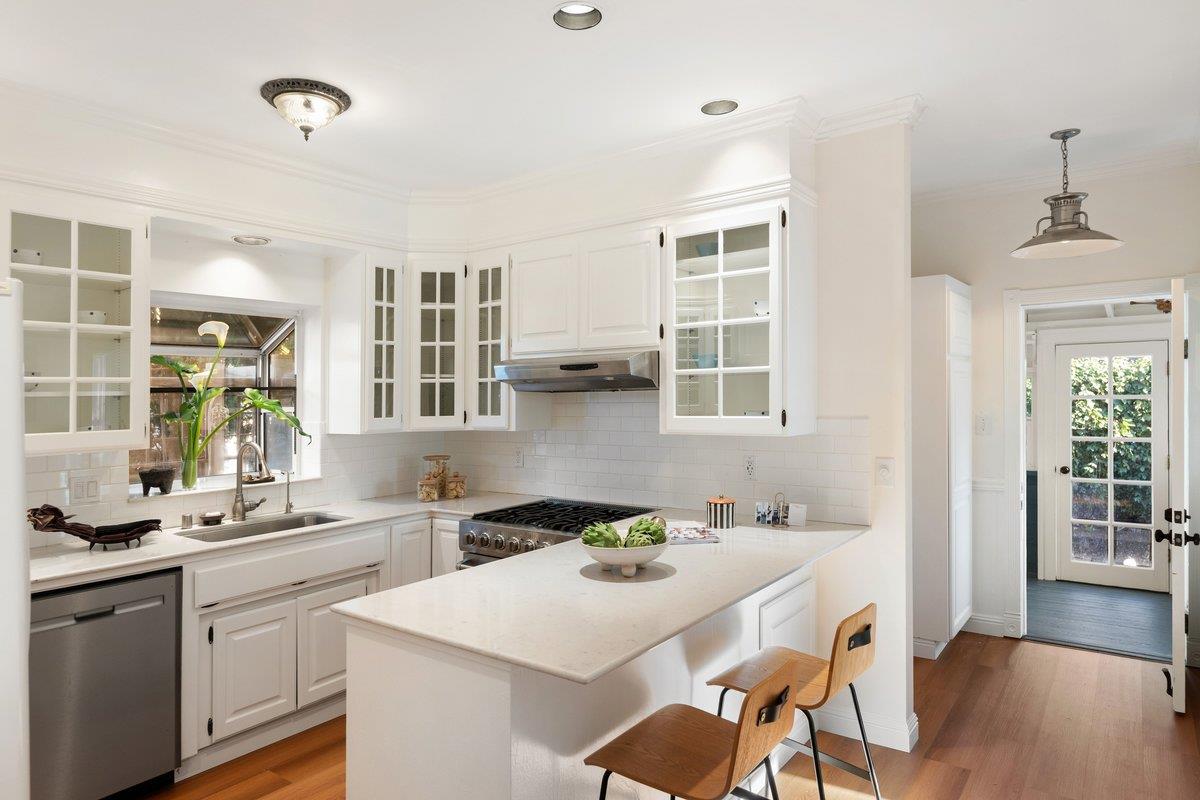 769 Jackson Street Santa Clara, CA 95050 - Photo 8 of 40 a kitchen with a sink stove and cabinets