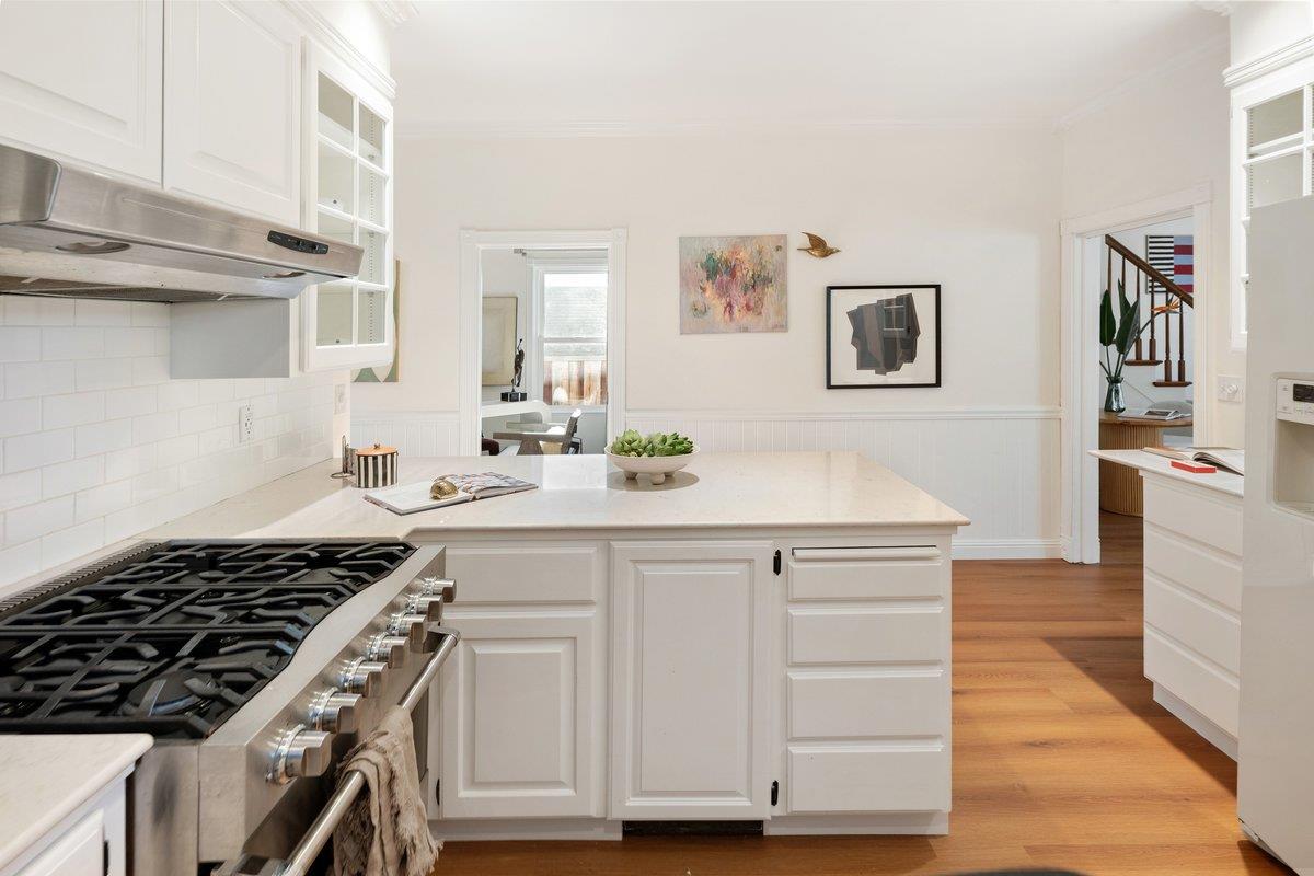 769 Jackson Street Santa Clara, CA 95050 - Photo 10 of 40 a kitchen with cabinets appliances and wooden floor