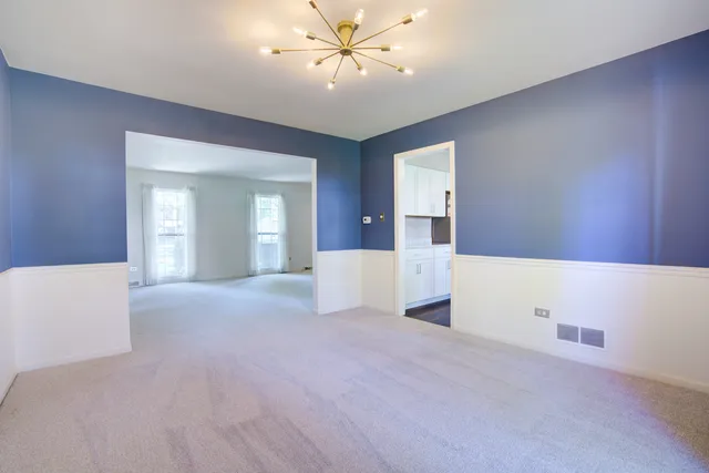 a view of an empty room with a fireplace