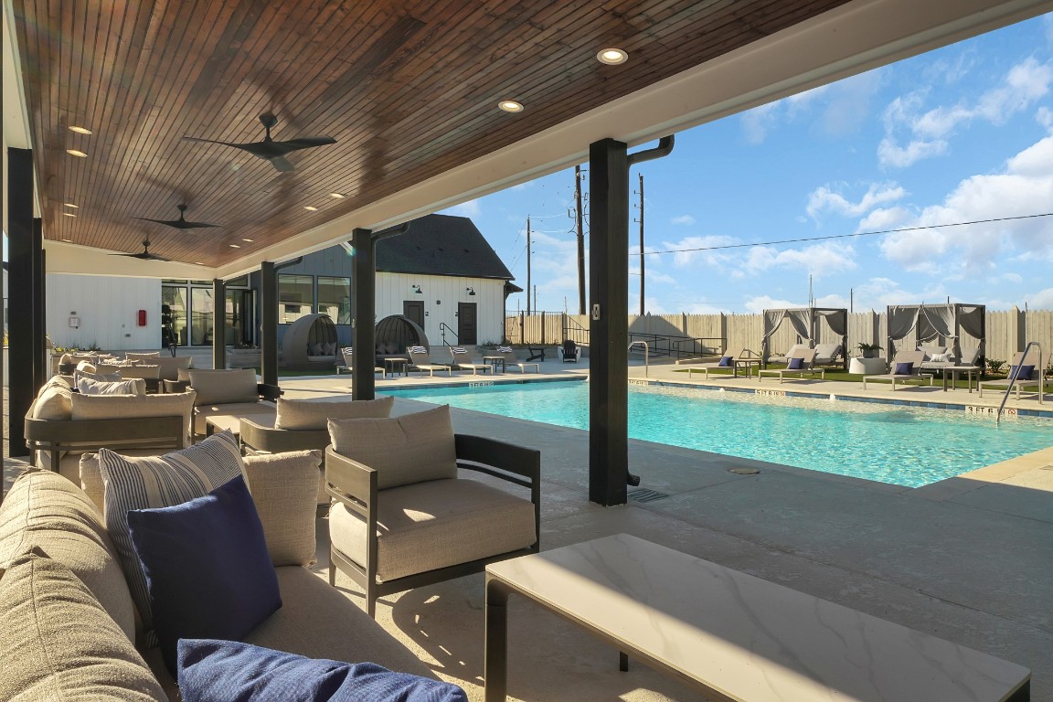 38634 Spur 149 Road, Unit 63A Magnolia, TX 77354 - Photo 25 of 50 COVERED SEATING OVERLOOKS THE STUNNING POOL AND LOUNGE!