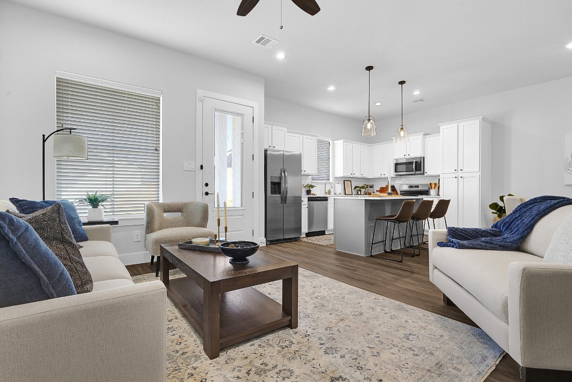 38634 Spur 149 Road, Unit 63A Magnolia, TX 77354 - Photo 5 of 50 WELCOME TO THE THREE BEDROOM! SOARING 10 FOOT CEILINGS, WOOD LAMINITE FLOORING (TWO OPTIONS- GREY OR BROWN), STAINLESS STEAL APPLIANCES AND SO MUCH MORE!