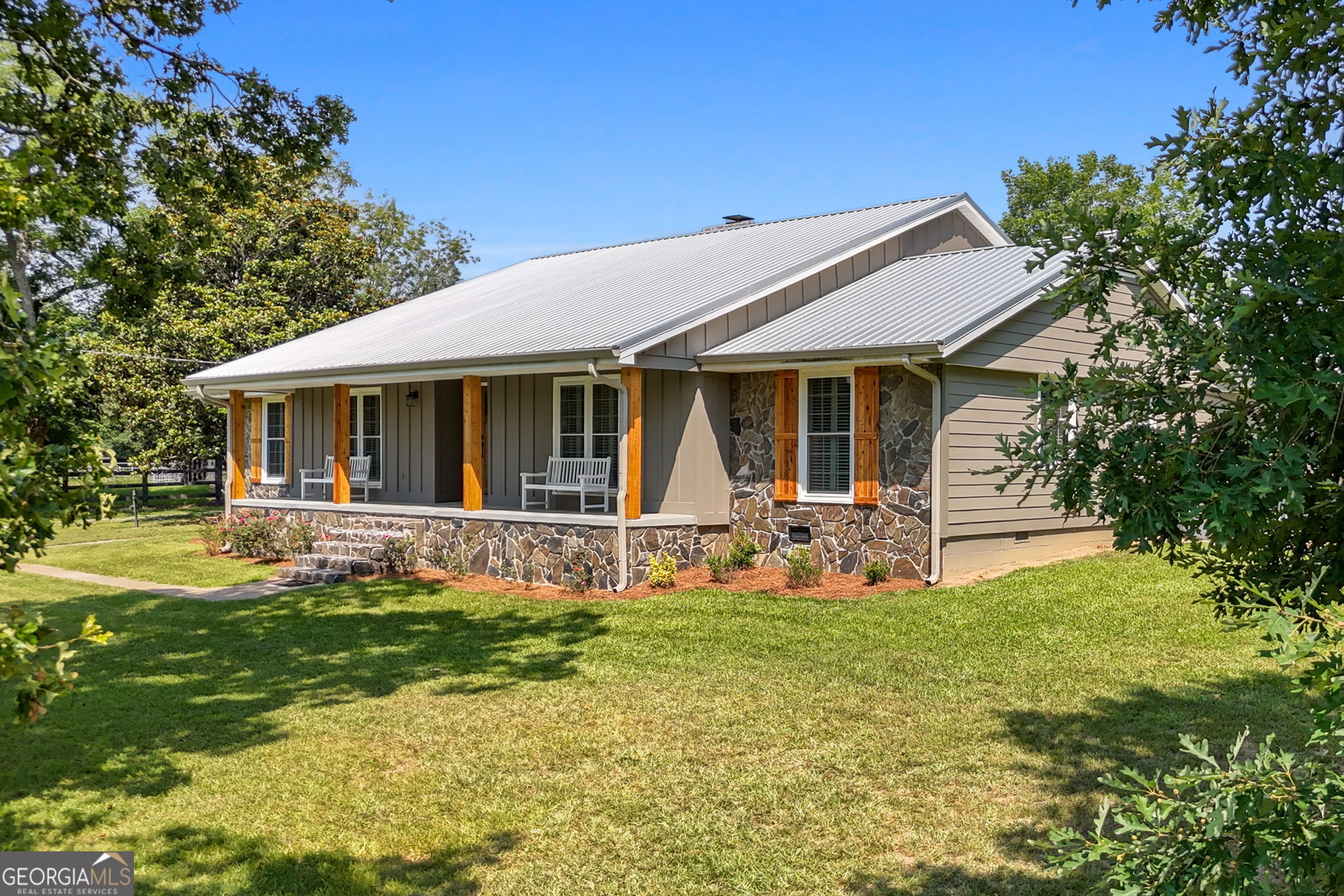 a front view of house with yard and green space