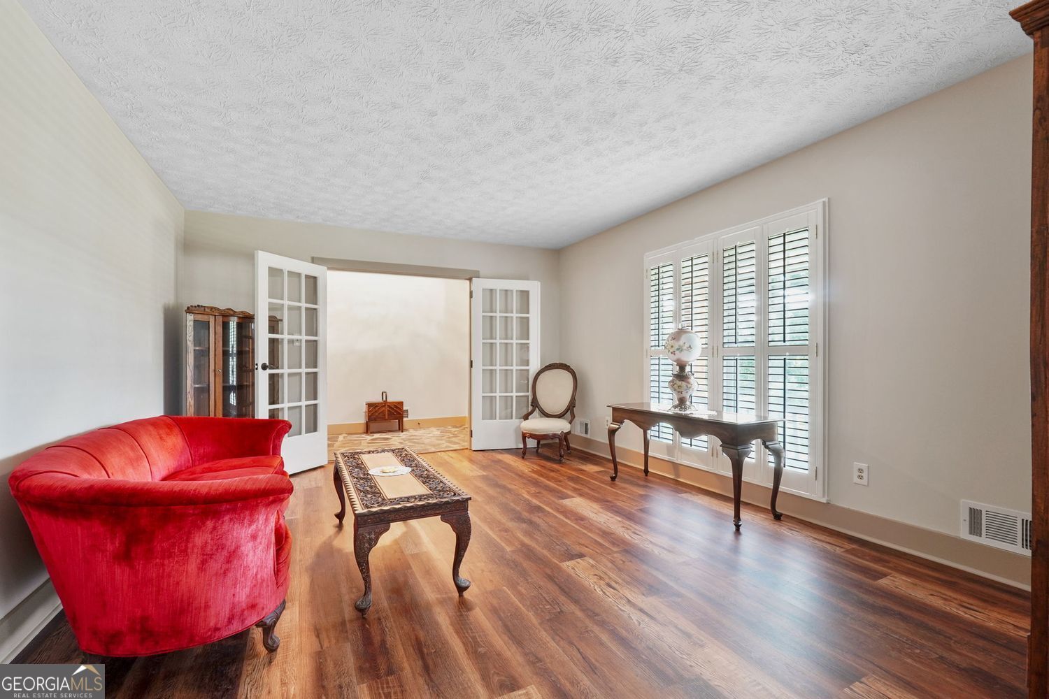 8272 Old Zebulon Road Molena, GA 30258 - Photo 11 of 53 a living room with furniture a window and a wooden floor