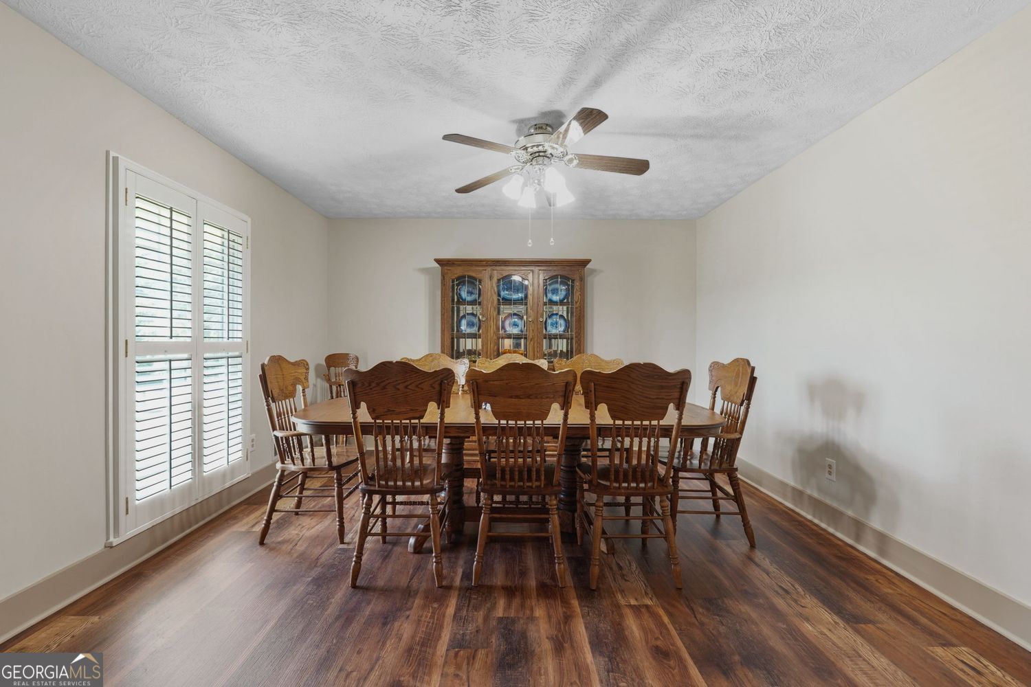 8272 Old Zebulon Road Molena, GA 30258 - Photo 12 of 53 a view of a dining room with furniture window and wooden floor