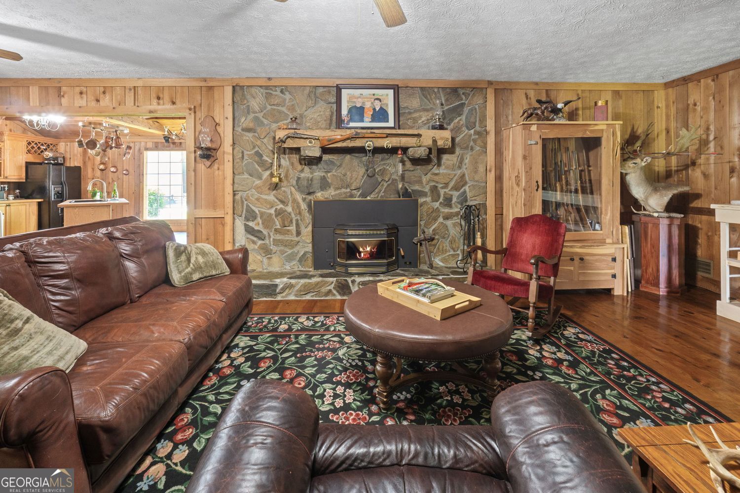 8272 Old Zebulon Road Molena, GA 30258 - Photo 17 of 53 a living room with furniture and a fireplace