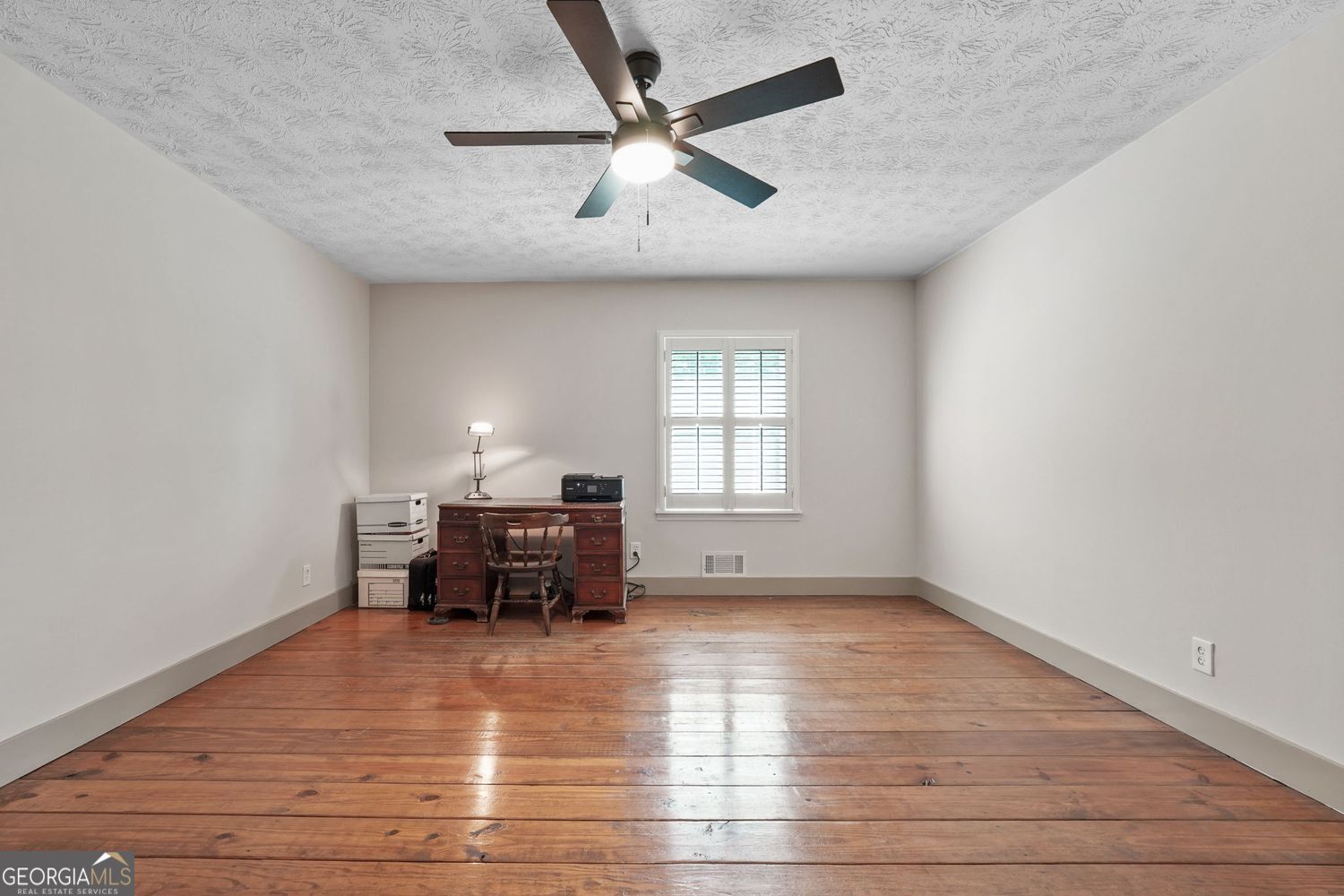 8272 Old Zebulon Road Molena, GA 30258 - Photo 19 of 53 wooden floor in an empty room with a window