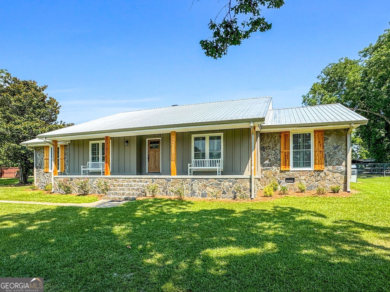8272 Old Zebulon Road Molena, GA 30258 - Photo 2 of 53 a front view of house with yard outdoor seating and green space