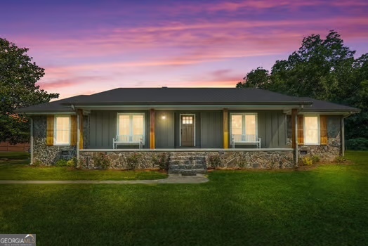 8272 Old Zebulon Road Molena, GA 30258 - Photo 3 of 53 a front view of a house with a garden