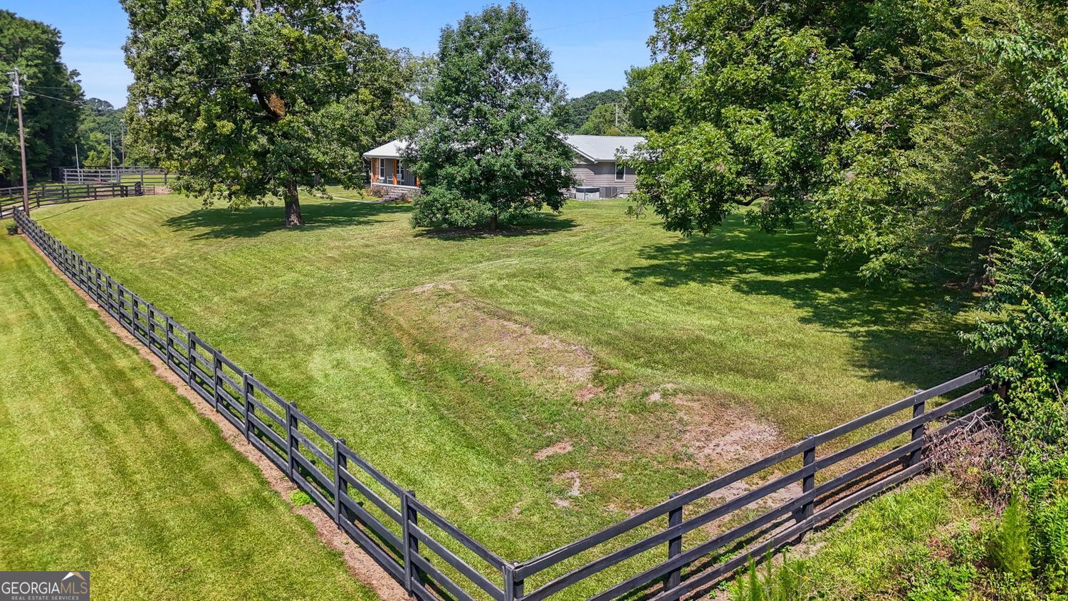 8272 Old Zebulon Road Molena, GA 30258 - Photo 43 of 53 a view of a yard with an outdoor seating