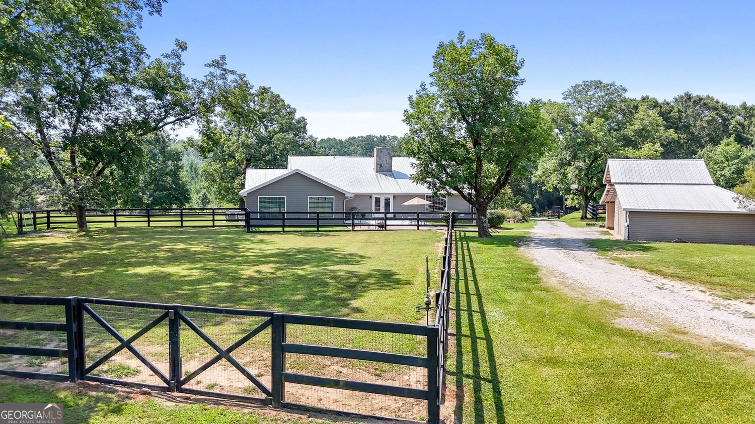 8272 Old Zebulon Road Molena, GA 30258 - Photo 45 of 53 a view of a swimming pool with a patio