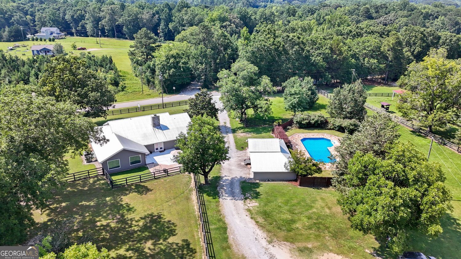 8272 Old Zebulon Road Molena, GA 30258 - Photo 46 of 53 an aerial view of a house with swimming pool a yard and outdoor seating