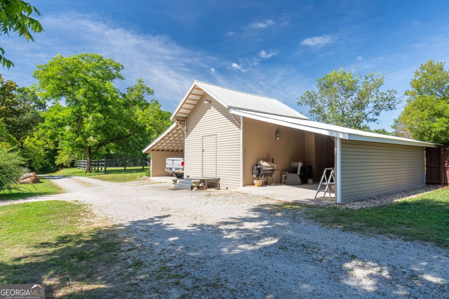 8272 Old Zebulon Road Molena, GA 30258 - Photo 47 of 53 a view of a house with backyard and sitting area