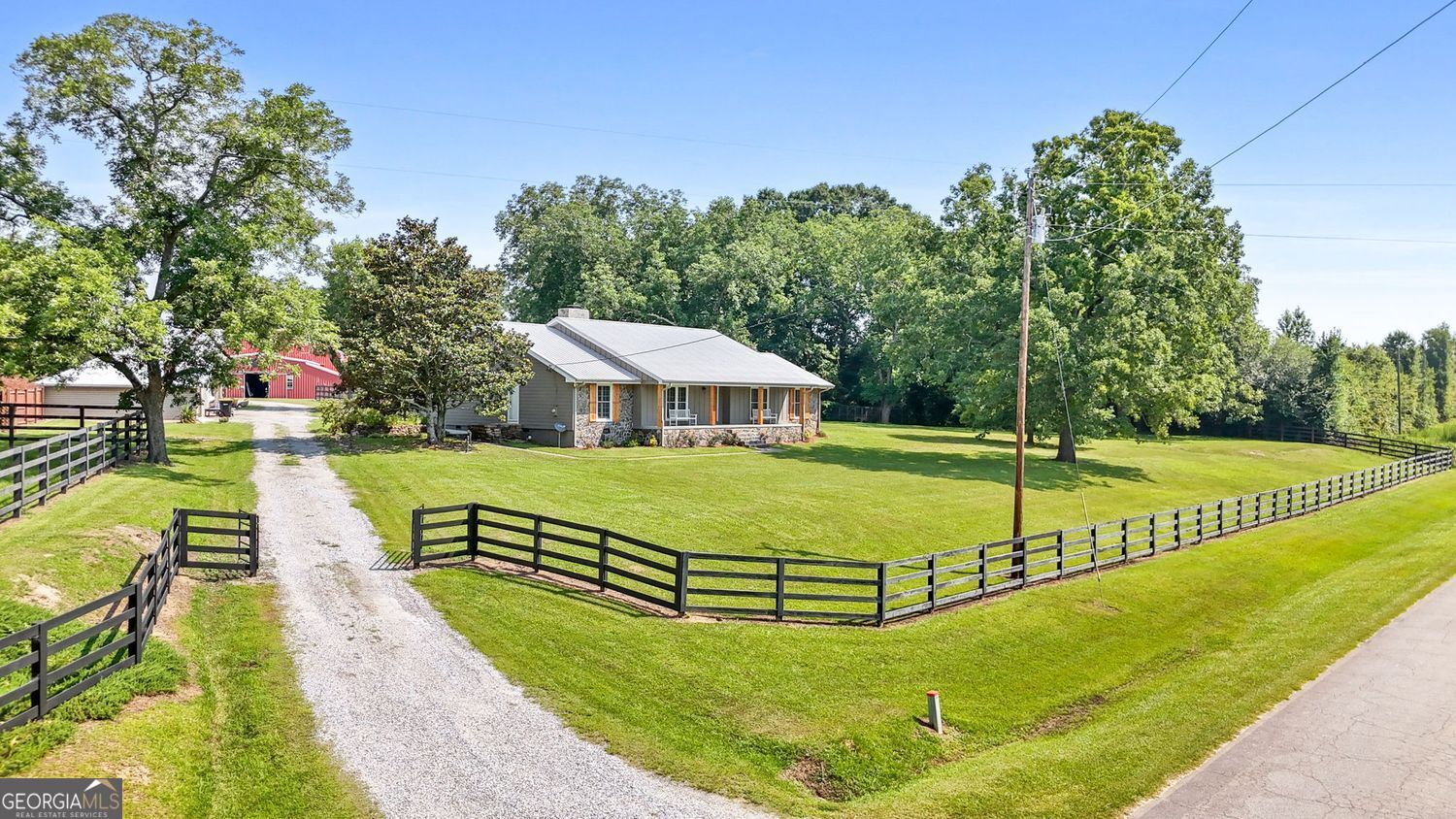 8272 Old Zebulon Road Molena, GA 30258 - Photo 5 of 53 a view of a swimming pool with an outdoor space and seating area