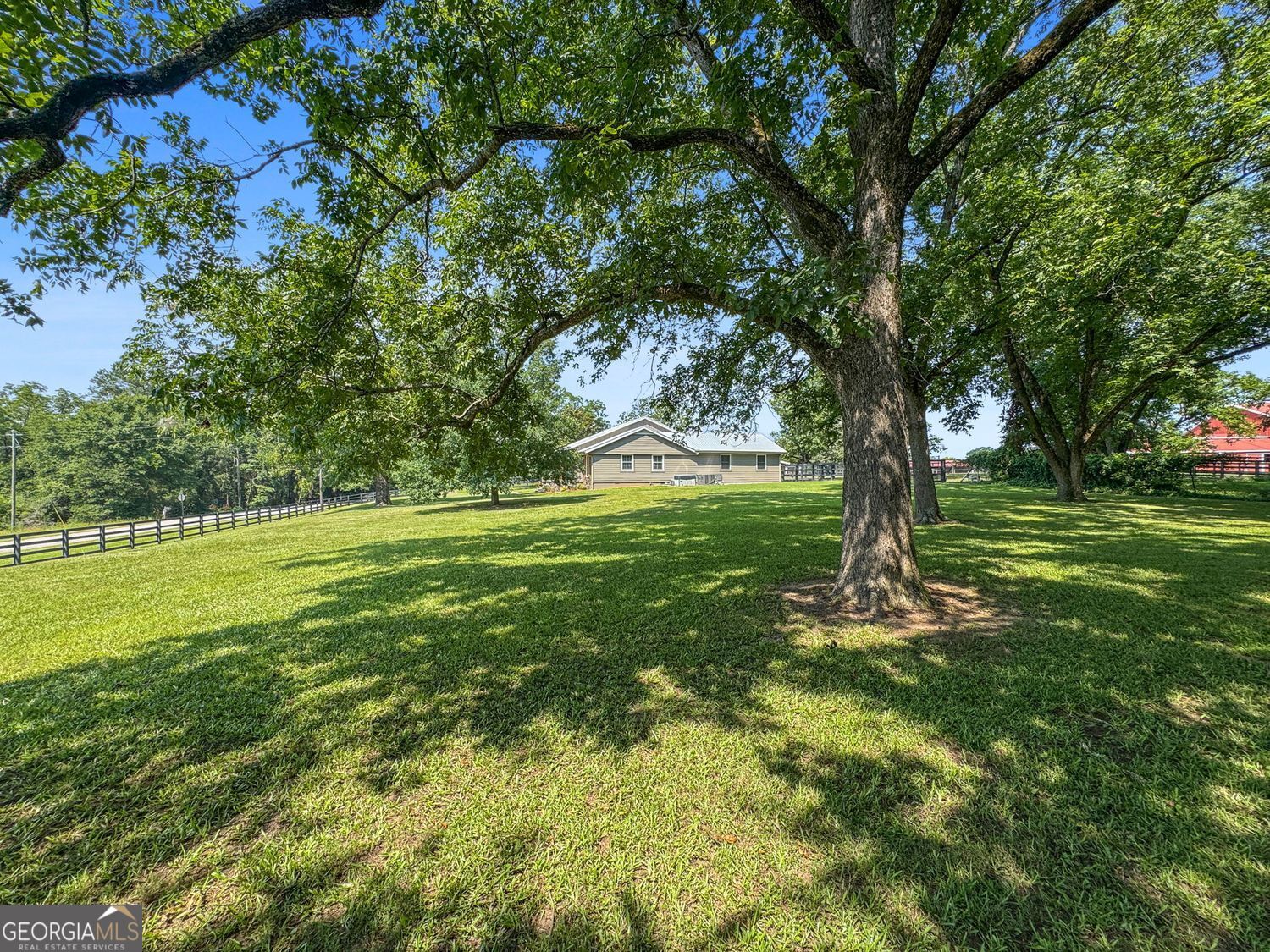 8272 Old Zebulon Road Molena, GA 30258 - Photo 52 of 53 a backyard of a house with lots of green space