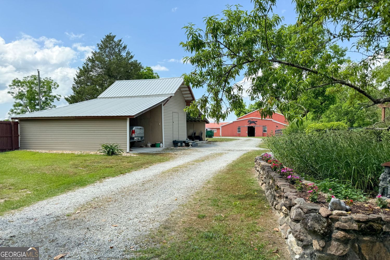 8272 Old Zebulon Road Molena, GA 30258 - Photo 6 of 53 a front view of a house with a yard and garage
