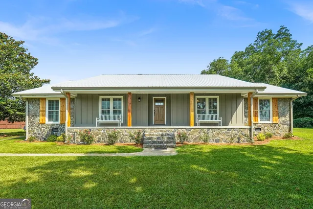 front view of a house with a yard