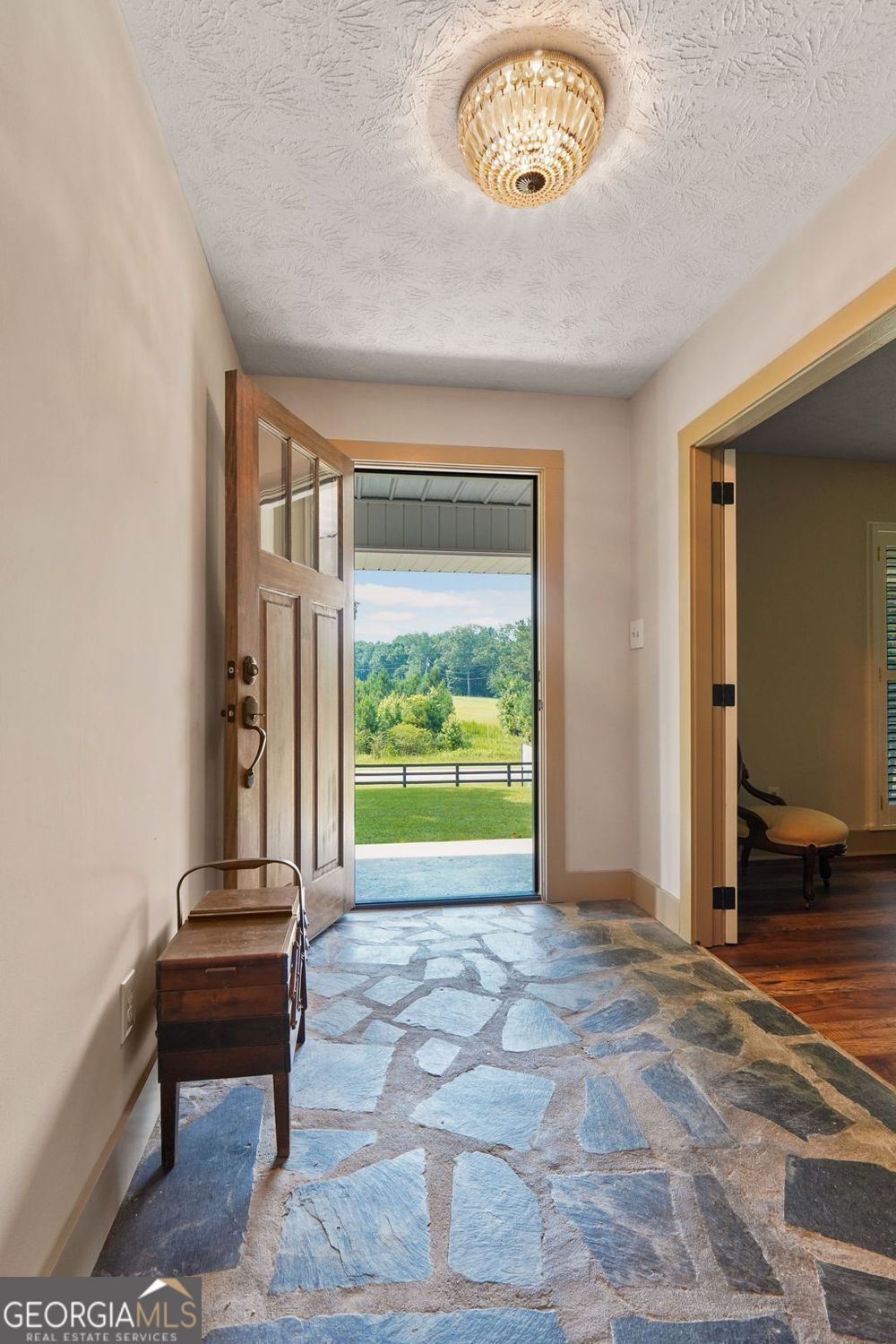 8272 Old Zebulon Road Molena, GA 30258 - Photo 9 of 53 a view of a livingroom with furniture and a floor to ceiling window