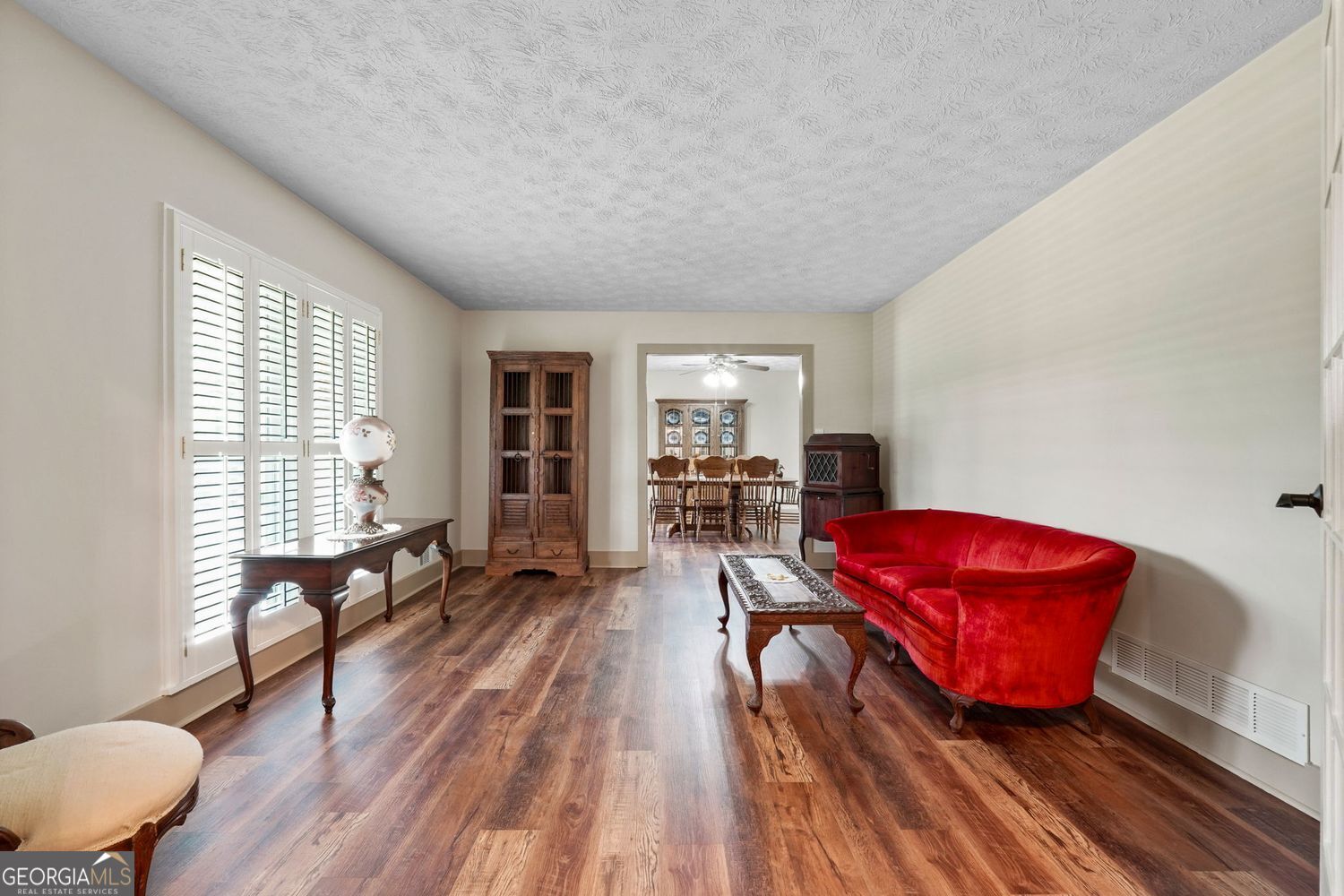 8272 Old Zebulon Road Molena, GA 30258 - Photo 10 of 53 a living room with furniture a rug and a window