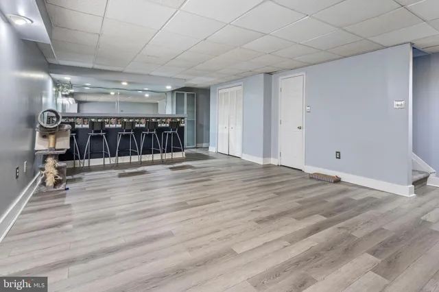 a view of room with wooden floor