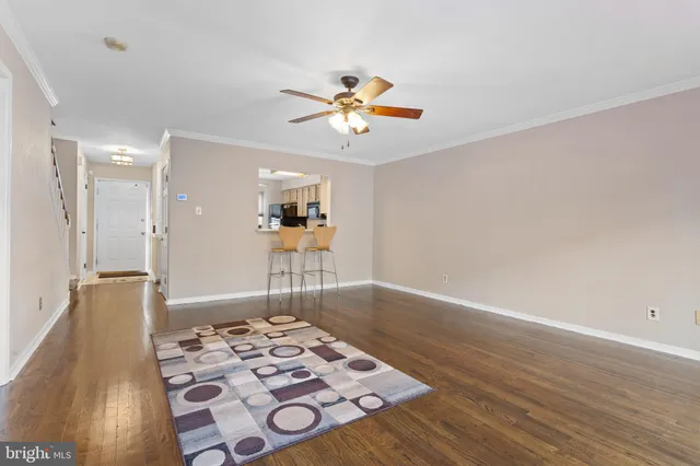 a view of a workspace with wooden floor