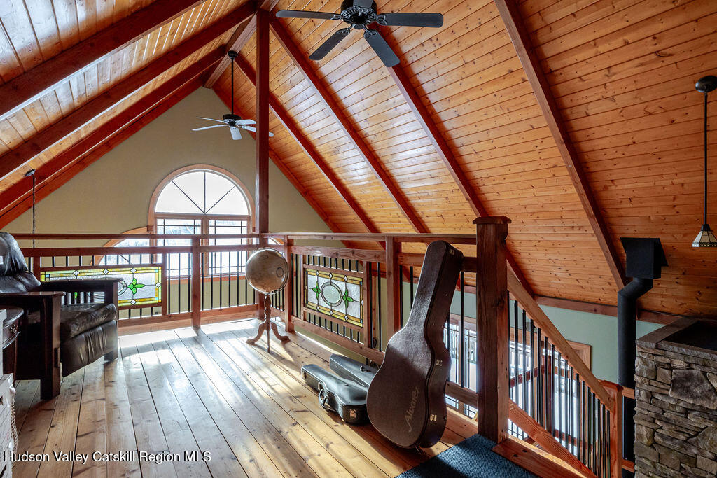 53 Snyder Pond Road Copake, NY 12516 - Photo 9 of 47 a view of staircase with a large window and wooden floor