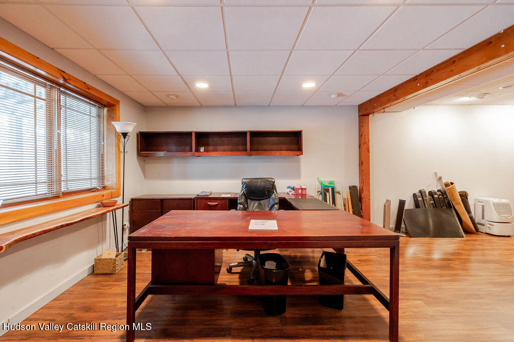 53 Snyder Pond Road Copake, NY 12516 - Photo 19 of 47 a view of a dining room with furniture window and wooden floor