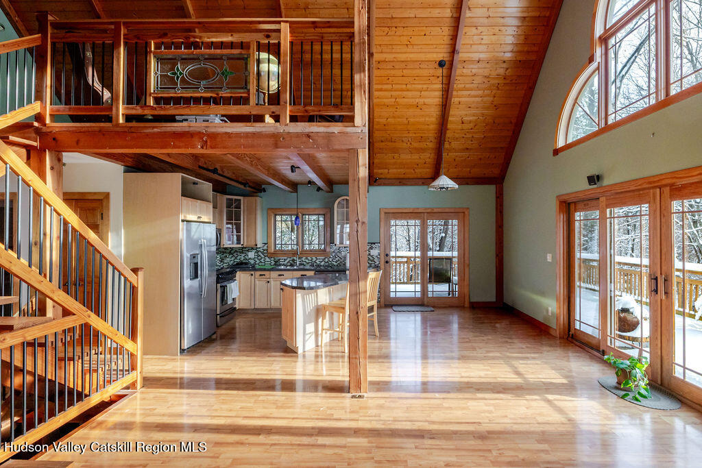 53 Snyder Pond Road Copake, NY 12516 - Photo 46 of 47 a view of a hall with wooden floor and a rug