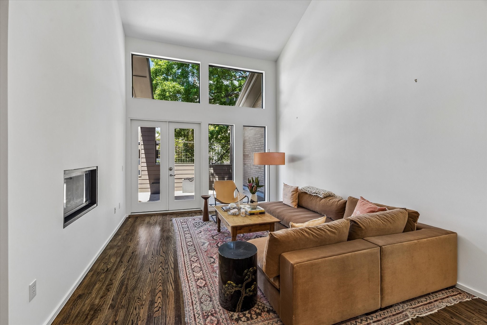 1007 Barkdull Street, Unit 4 Houston, TX 77006 - Photo 6 of 28 Family room also has a modern electric fireplace and accesses a large deck that overlooks the front of the property.