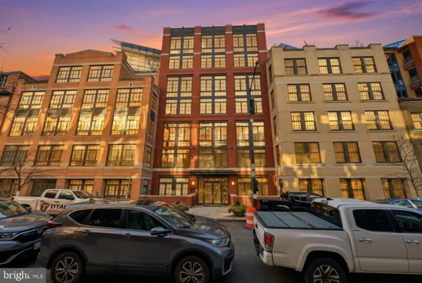 a front view of a building with parking space