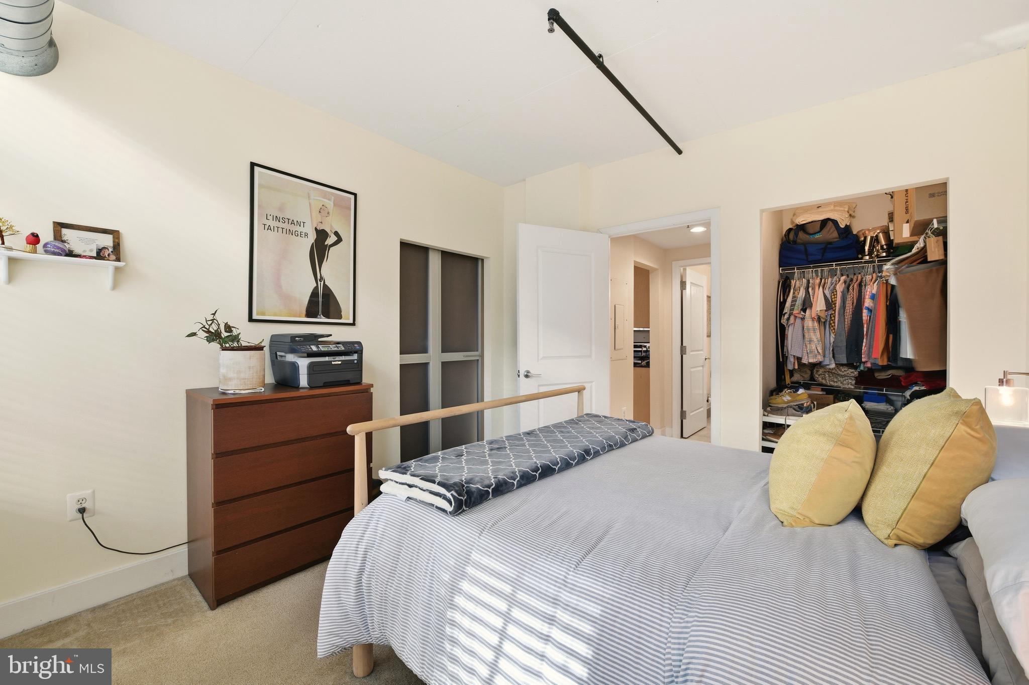 1444 Church Street Northwest, Unit 206 Washington, DC 20005 - Photo 15 of 19 a bedroom with a bed and dresser