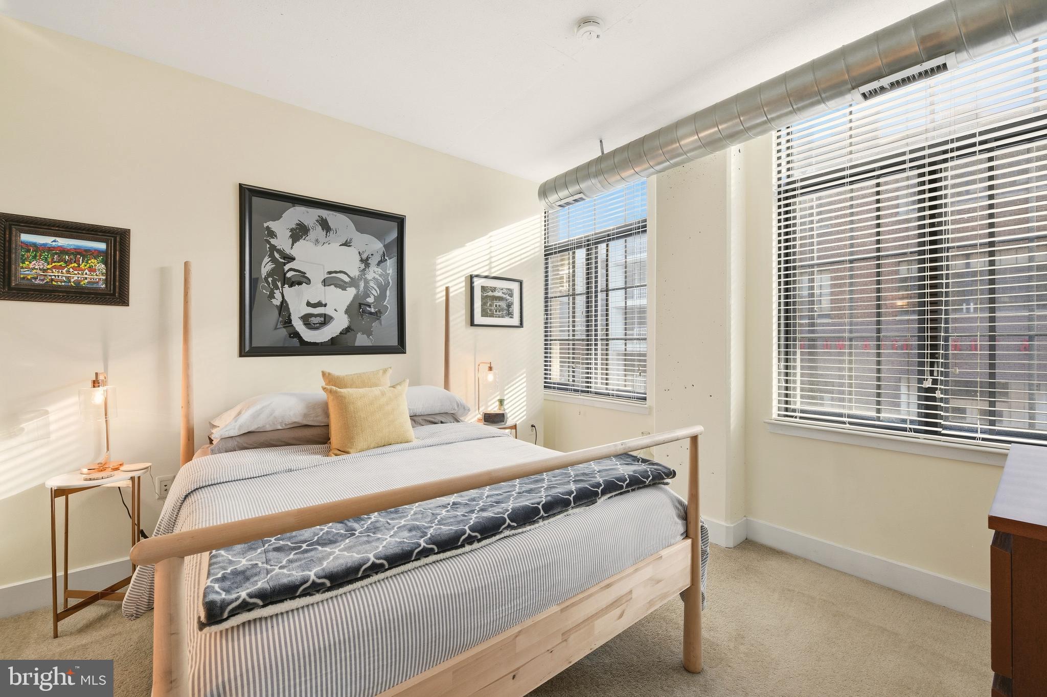 1444 Church Street Northwest, Unit 206 Washington, DC 20005 - Photo 17 of 19 a bedroom with a bed and a window