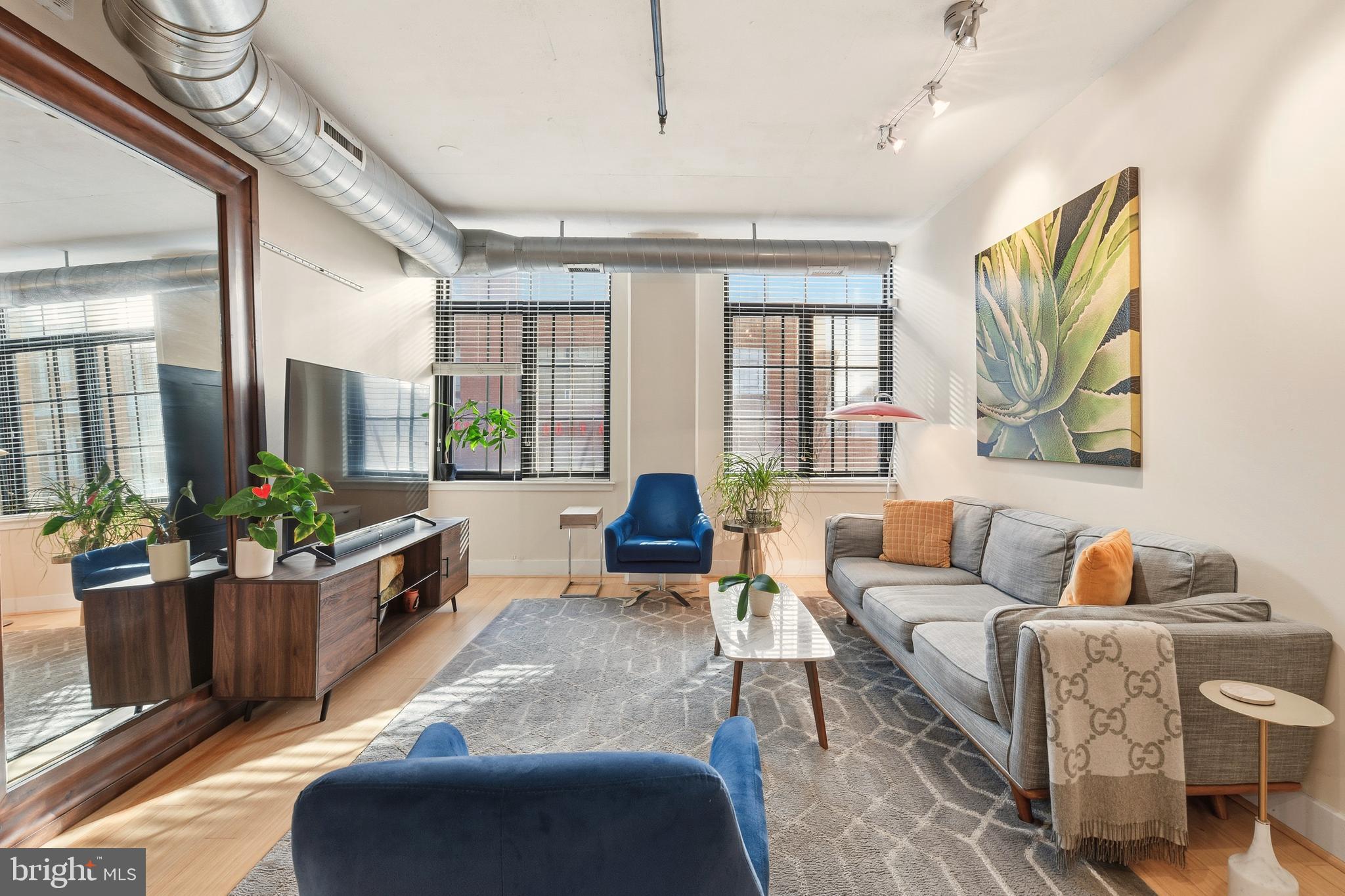 1444 Church Street Northwest, Unit 206 Washington, DC 20005 - Photo 5 of 19 a living room with furniture and a large window