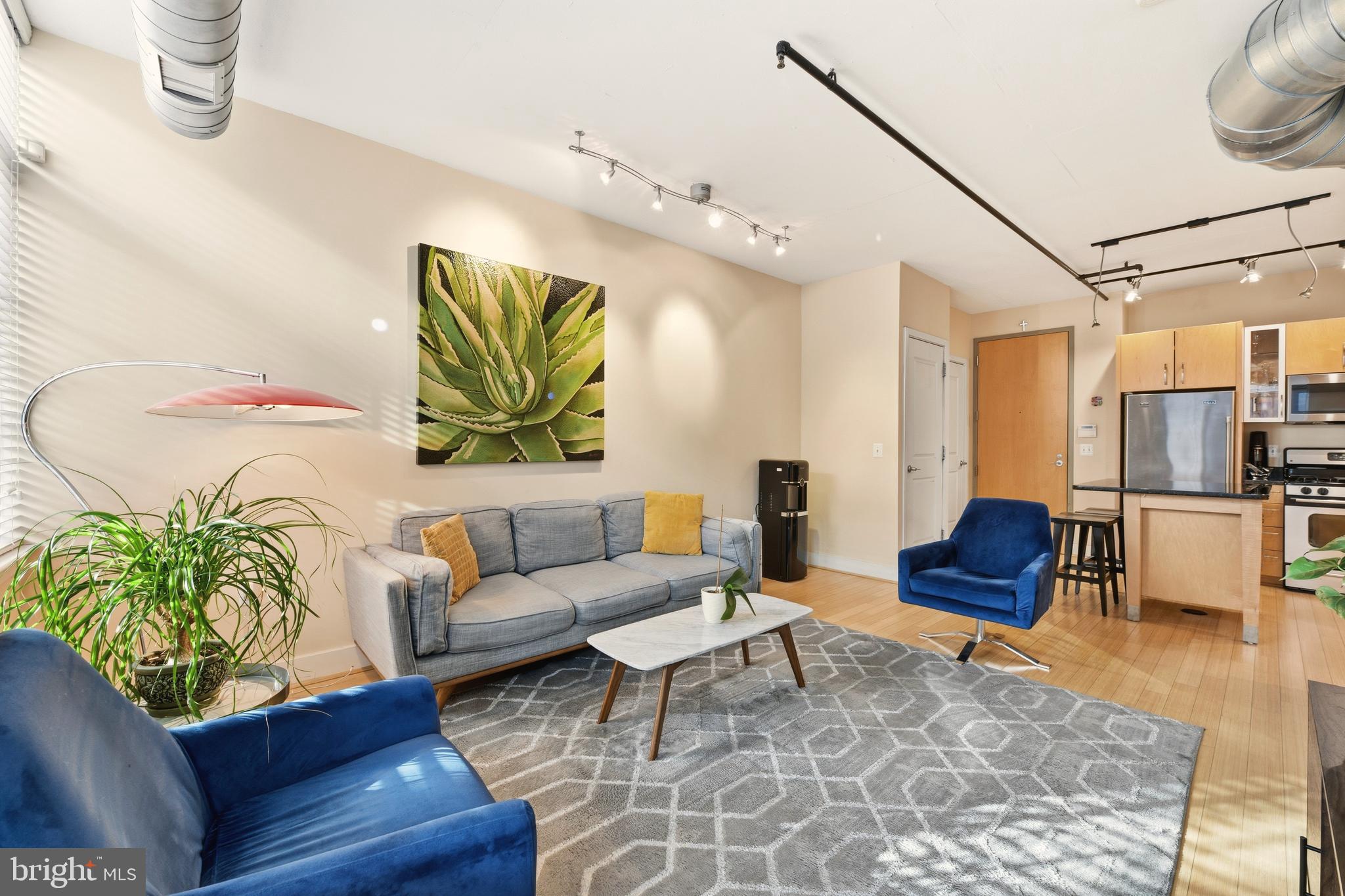 1444 Church Street Northwest, Unit 206 Washington, DC 20005 - Photo 8 of 19 a living room with furniture and wooden floor