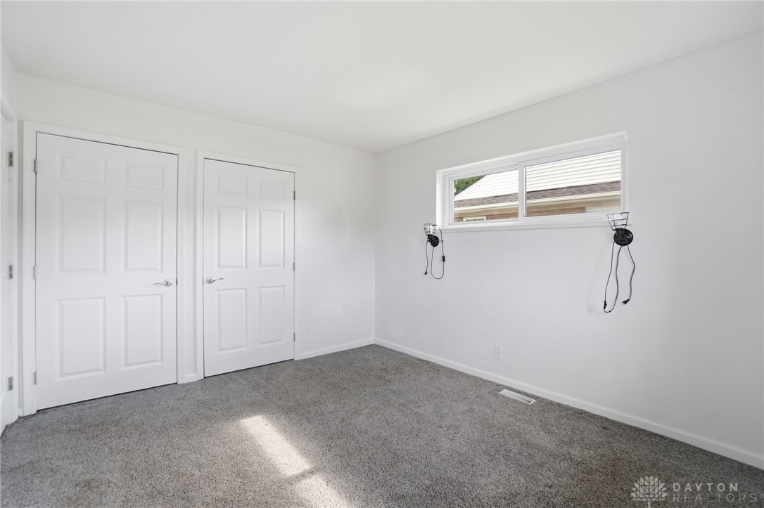 629 Storms Road Dayton, OH 45429 - Photo 40 of 51 Bright and airy, this comfortable bedroom features soft carpeting and ample natural light.
