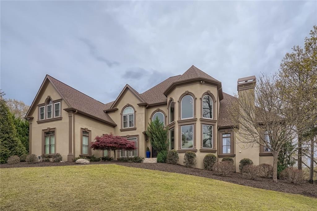 Custom executive home sits atop a 2+ acre lot with incredible year-round views. 