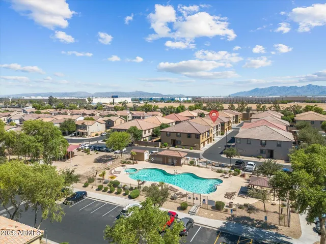 an aerial view of residential houses with outdoor space